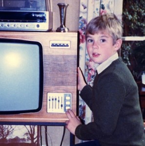 Jim aged 8 or 9 watching a shuttle launch on TV