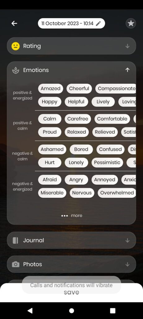 A screenshot of a phone. A screenshot of a phone. The date 11/10/2023 at the top. Then a smiley face rating of yellow sidewise smile face. Then the emotions tab expanded. Sections of positive and energised, positive and calm, negative and calm and negative and energised. Some of the emotions listed are amazed, cheerful, happy, lively, calm, carefree, comfortable, proud, relaxed, afraid, angry, annoyed, nervous, overwhelmed.