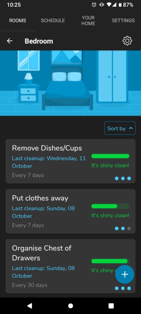 A screenshot of a phone.  At the top  is a cartoon of a bedroom. Underneath are bubbles with the headings Put clothes away and Organise Chest of Drawers. They both have the date of last cleaning 08/10/2023 and full green sliding scale. Before these bubbles is the bubble with the heading Remove Dishes/Cups with a last cleaning date of Wednesday 11th October.